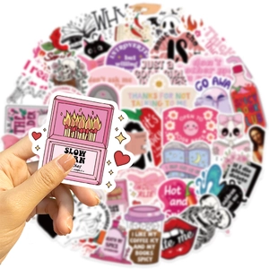 Close-up of waterproof vinyl bookworm stickers featuring pink matchbox and smut reader art