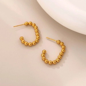 Detailed view of 18K gold plated stainless steel C-shaped beaded stud earrings
