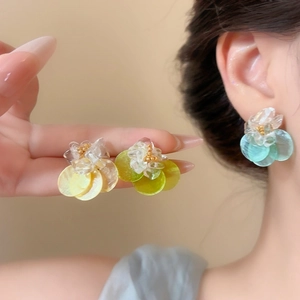 Close-up of shell flower stud earrings in fresh dopamine colors for summer vacation