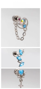 Three silver cartilage earrings featuring blue opal heart and marquise zircon designs