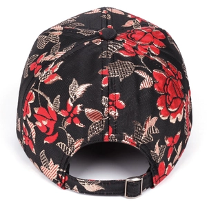 Detail of ethnic baseball cap showing rose embroidery and adjustable metal buckle