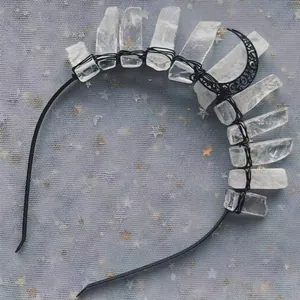 Detail of handmade black moon headband with raw white quartz crystals and wire wrapping