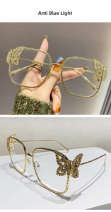 Detail of oversized square glasses with sparkling rhinestone butterfly temple accents