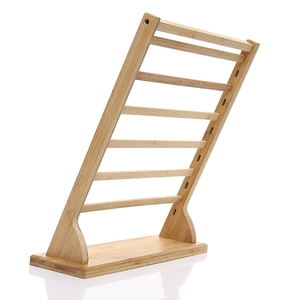 Multi-tier bamboo earring display stand with natural wood finish and tiered design