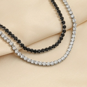 Polished stainless steel tennis necklace set with 5A cubic zirconia on silk satin