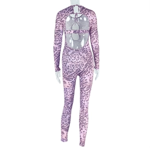 Detailed back view of purple leopard print jumpsuit featuring cutout back and slim fit