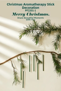 Macro detail of dark green pine scented sticks with metal hooks on Christmas tree branch