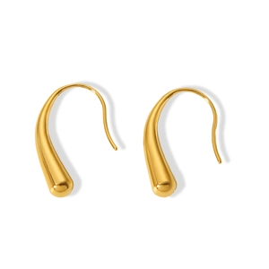 Close-up of golden teardrop earrings with a smooth polished metallic finish for women