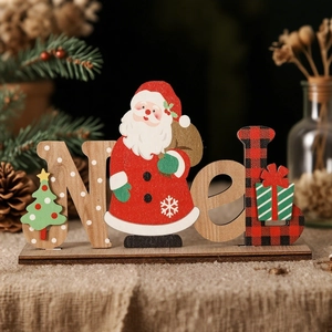 Detailed view of Noel wooden Christmas ornament with Santa and pine cone background