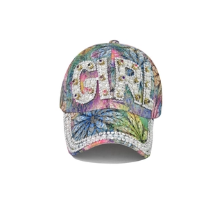 Close-up of sparkling GIRL rhinestone lettering and pearl trim on floral baseball cap