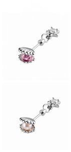 Detailed view of star pendant cartilage studs with shell inlay and pearls