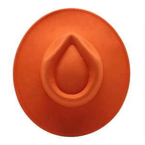Top view of bright orange wool felt fedora showing drop-shaped crown and reinforced brim