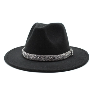 Close-up of black felt fedora hat with a sparkling silver rhinestone decorative band