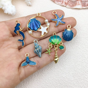 Blue ocean mermaid and starfish alloy charms for DIY jewelry making on beach background
