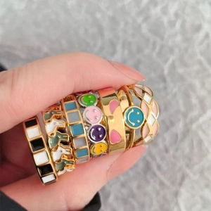 Set of 7 colorful enamel gold-plated adjustable rings with heart and smiley patterns