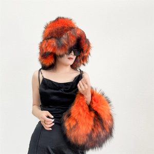 Detailed close-up of the plush faux fur texture and vibrant orange-black marble pattern