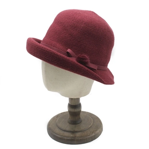 Elegant burgundy knitted cloche hat for elderly women with bow and pompom detail