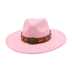 Detail of a pink wide-brimmed cowboy hat with a bull head buckle decorative band