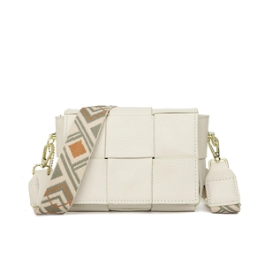 Detail of off-white leather shoulder bag with woven texture and embroidered wide strap