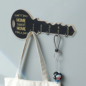 Vintage wooden wall key holder with five metal hooks and Home Sweet Home lettering