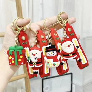 Cartoon Christmas PVC keychains featuring Santa and Snowman with Merry Christmas wrist strap