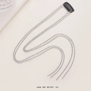 Detailed view of 40cm rhinestone hair chain with black BB clip and silver tassels