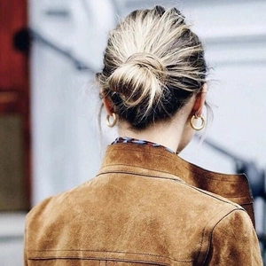 Classic 18K gold plated thick hoop earrings shown on model for stylish everyday wear