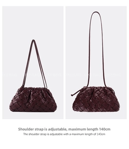 Detail of adjustable leather strap max 140cm on burgundy woven cloud bag