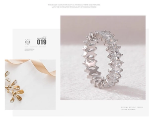 Close-up of a silver eternity ring featuring marquise-cut zircons in a micro-pave setting