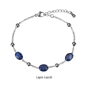 Detail of silver chain bracelet featuring deep blue lapis lazuli beads and polished silver beads