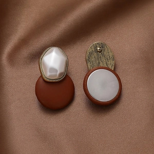 Retro faux leather and pearl geometric stud earrings with a gold-tone vintage finish