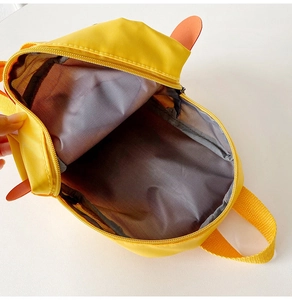 Internal view of a cute yellow duck toddler backpack showing grey lining and zipper