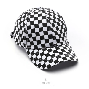 Detail of the black and white checkerboard pattern on a six-panel cotton baseball cap