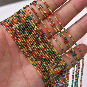 Close-up of vibrant 2mm faceted crystal beads held in hand for DIY jewelry making