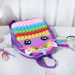 Macro view of unicorn pop backpack showing shiny purple laser material and silicone texture