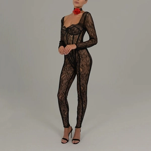 Detail view of sheer black lace bodysuit featuring low cut neckline and floral neck accessory
