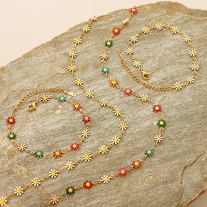Set di gioielli in acciaio inossidabile dorato con margherite smaltate colorate