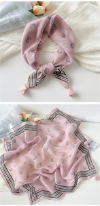 Pink cotton linen scarf featuring horseshoe patterns and corner tassels with a soft texture