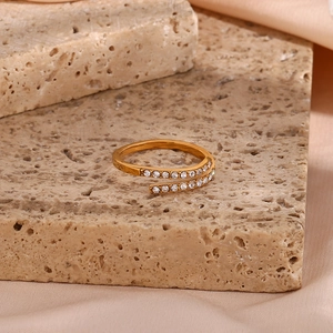 Detail of adjustable gold-plated stainless steel ring with spiral double-row cubic zirconia