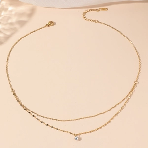 Double layered gold stainless steel necklace with round white cubic zirconia pendant