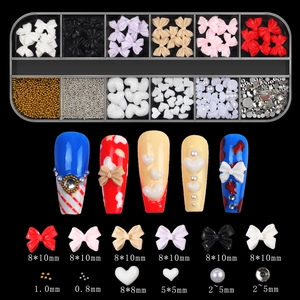 Macro view of 12-grid nail art kit with aurora bows, pearls, and mini rhinestones