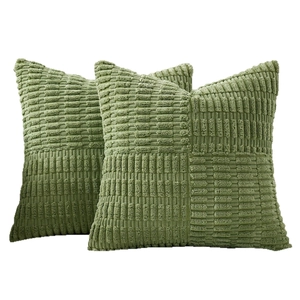 Pair of square green textured plush pillow covers displayed on a clean white background