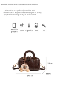 Brown Boston bag dimensions 17.5x13x11cm with strap and lion plush keychain accessory