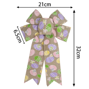 Linen Easter bow with colorful egg and butterfly prints, measuring 21cm by 32cm