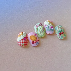 3D embossed rabbit press on nails with cherry and biscuit charms on a soft pink base