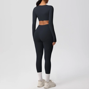 Rear view of black high-elasticity yoga set with long sleeve crop top and leggings