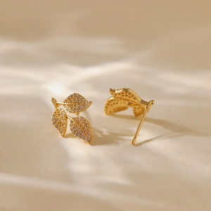Elegant 18K gold plated leaf stud earrings with sparkling zircon crystals for women