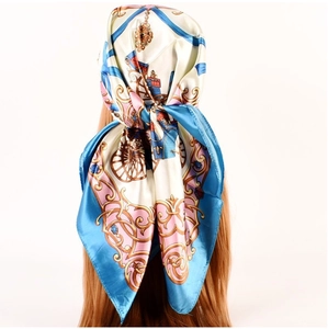 Detail of silk-satin scarf with carriage print and baroque pattern on a wig prop