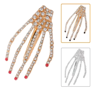 Barrettes main de squelette avec strass brillants en or et argent avec détails rouges
