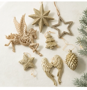 Décorations de Noël en résine champagne avec ailes scintillantes et étoiles sur velours